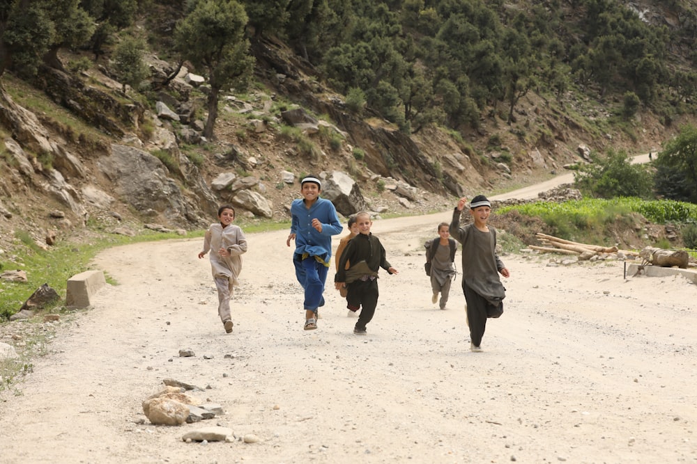 people walking on brown sand during daytime