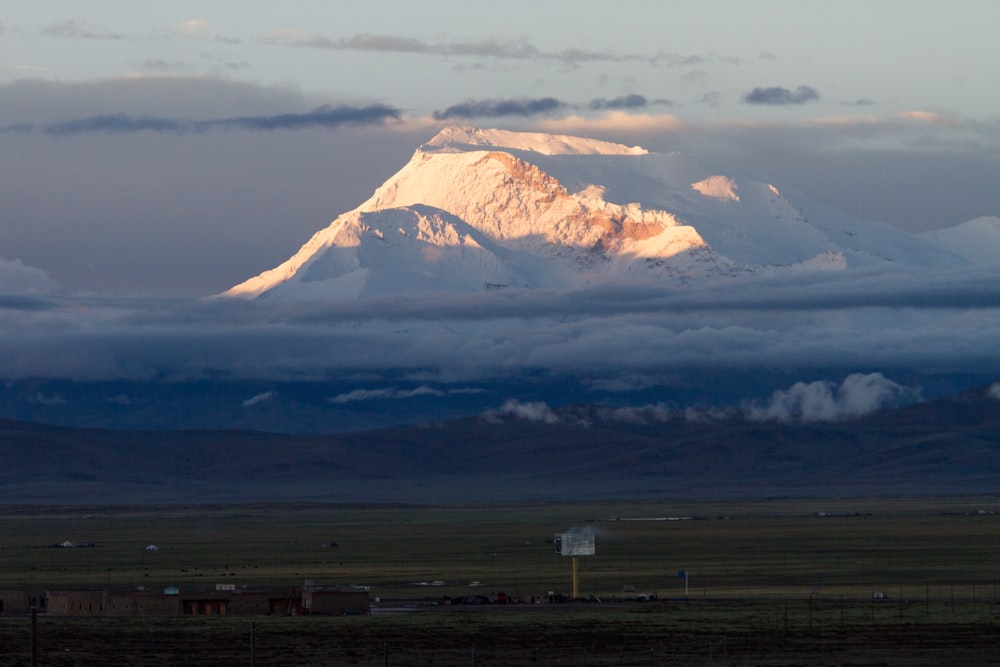 white and brown mountain under white clouds during daytime