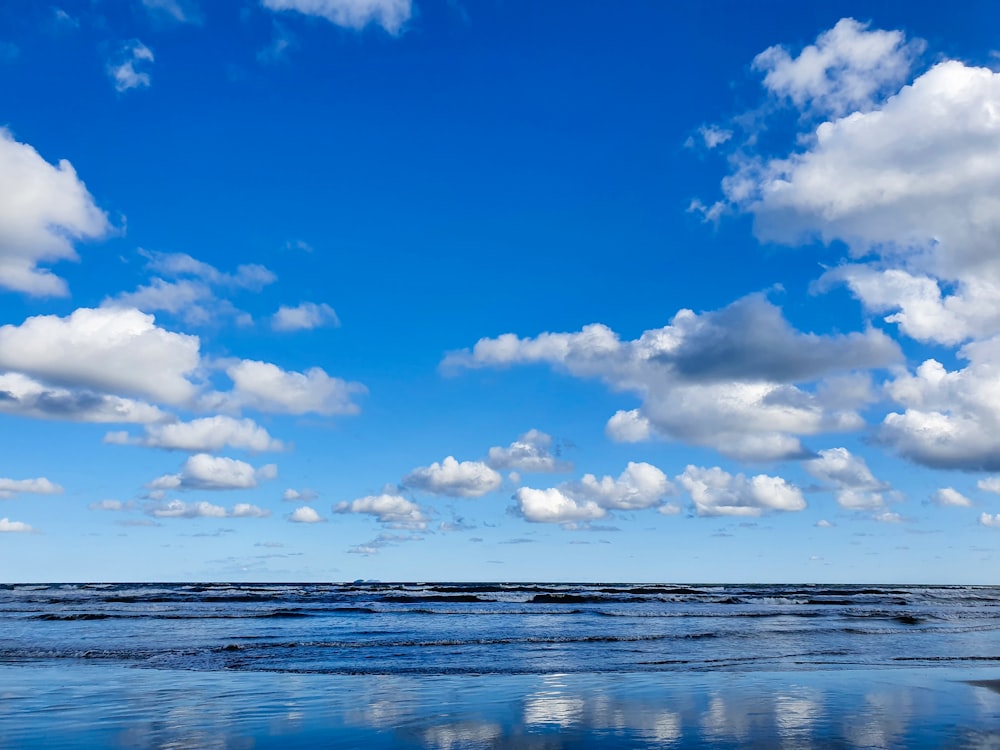 blue sky and white clouds over the sea