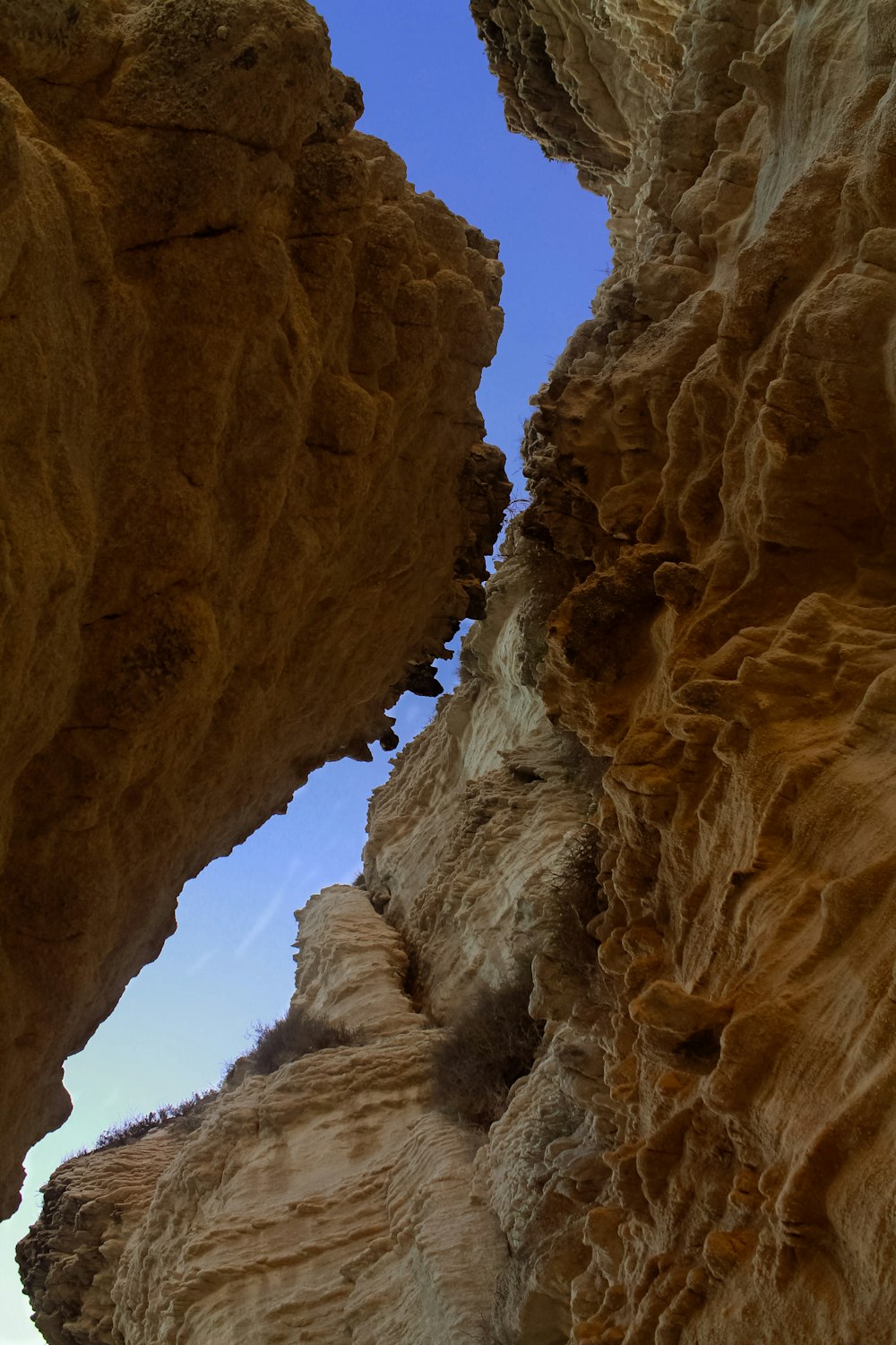 brown rock formation under blue sky during daytime