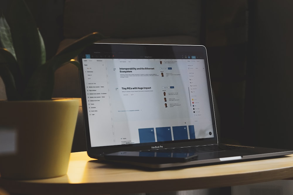 black tablet computer on brown wooden table