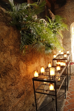 lighted candles on black metal candle holder