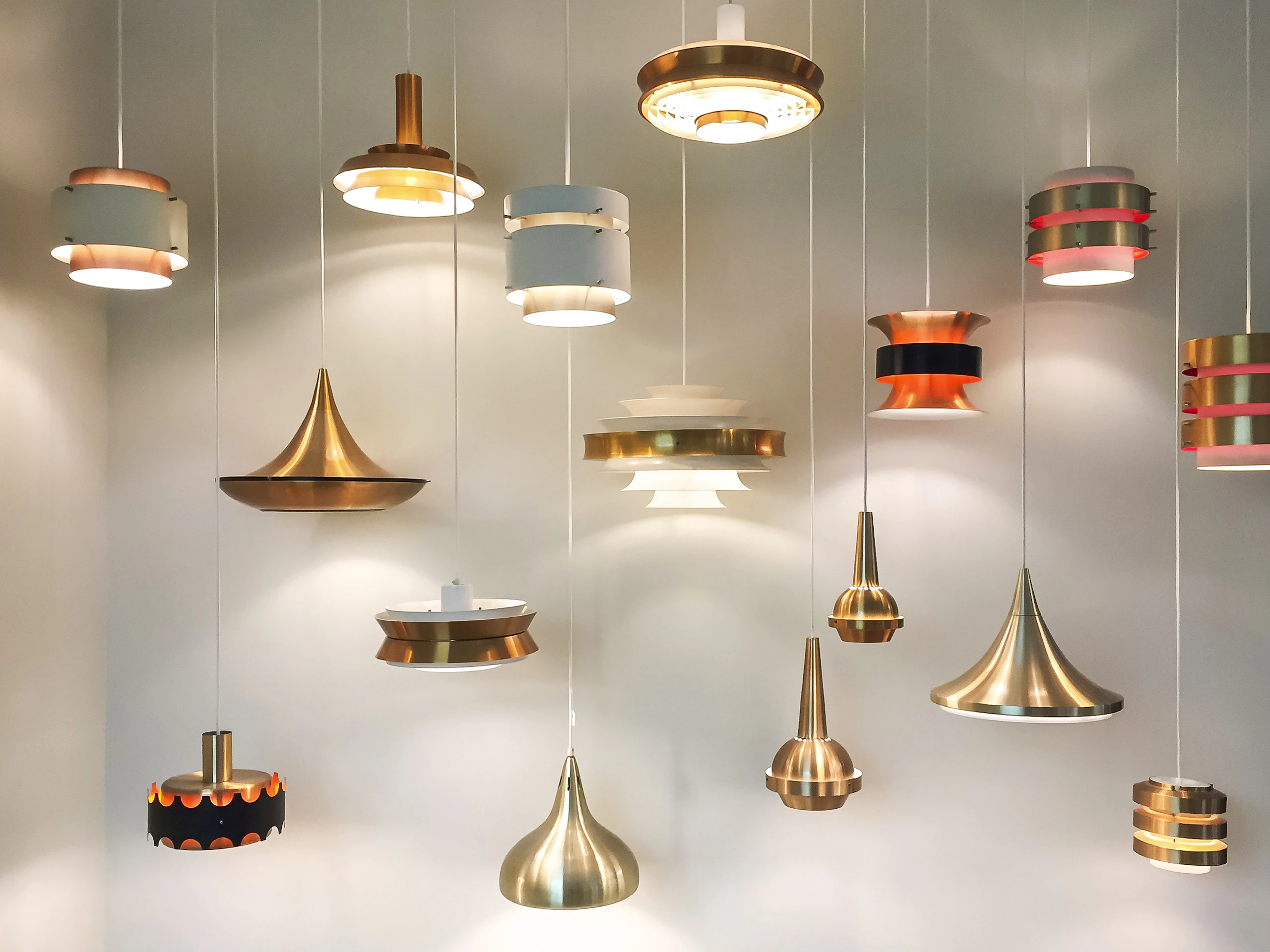 Display of brass and copper pendant lamps