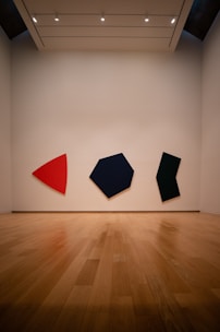 black and red textile on brown wooden parquet flooring
