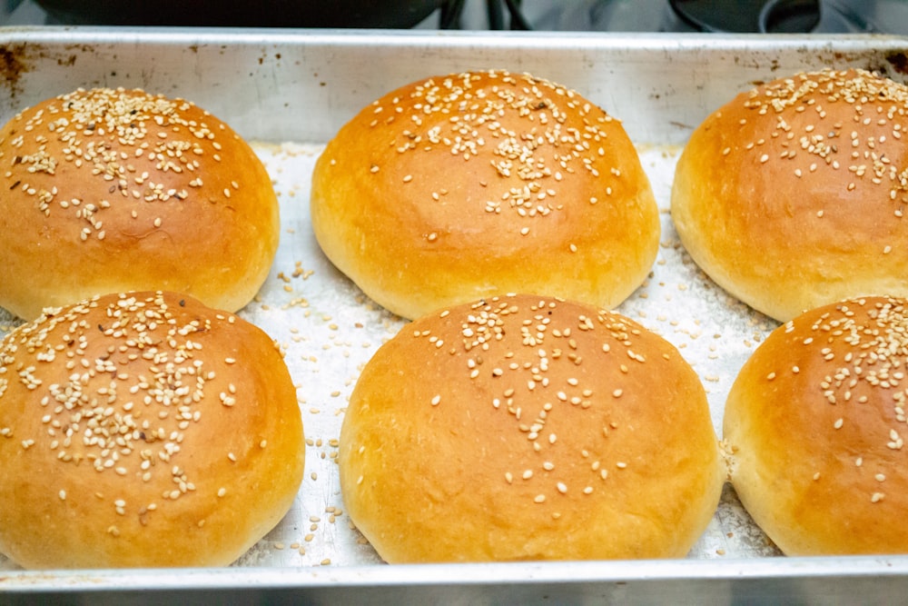 brown and white donuts on white tray