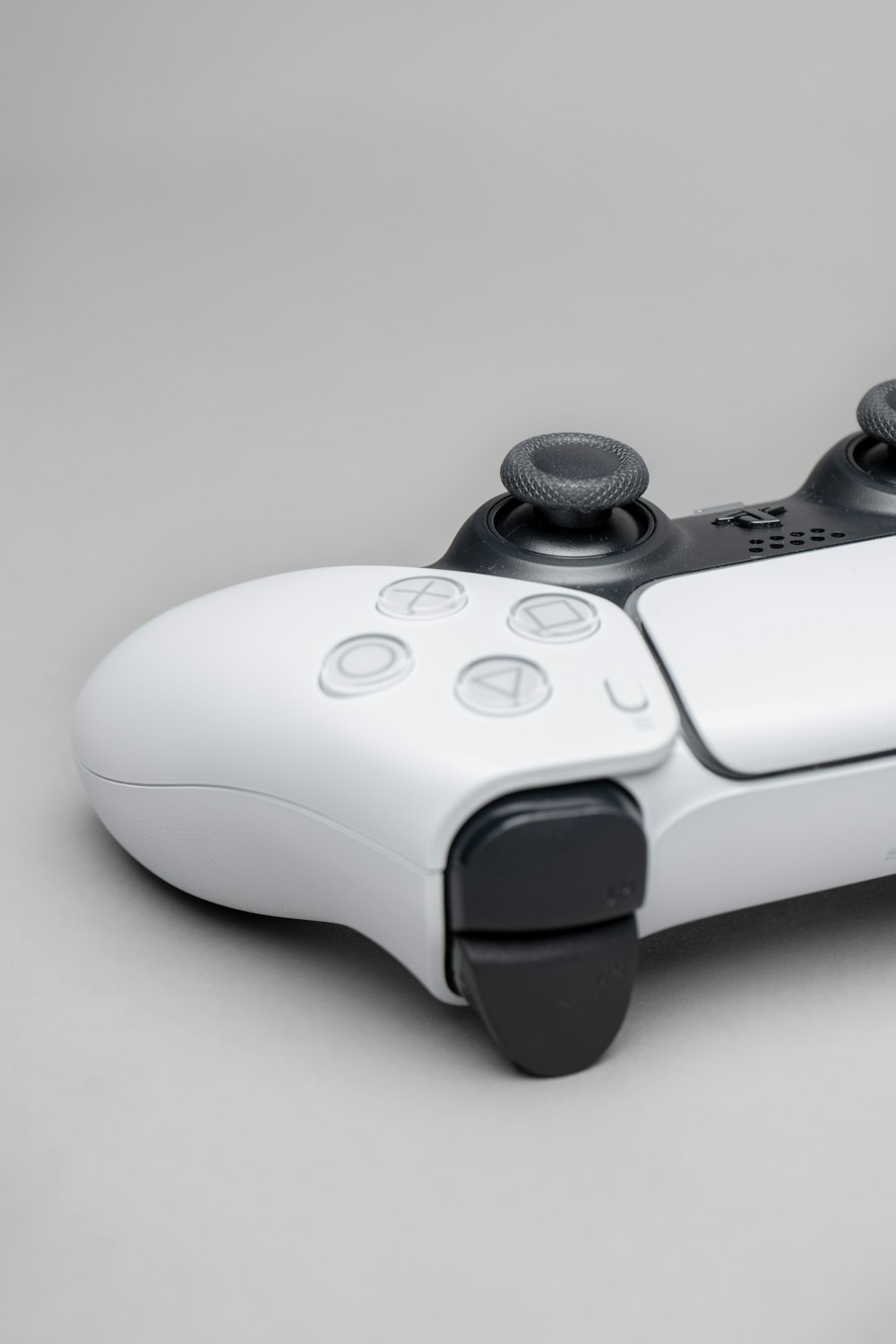 white and black game controller