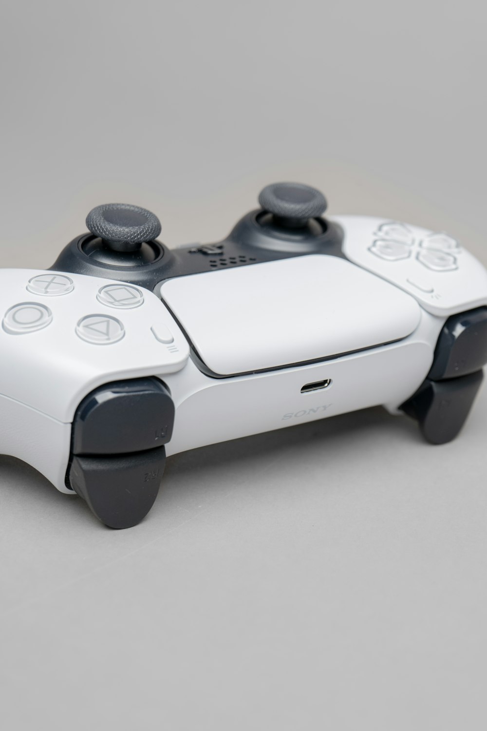 white and black game controller