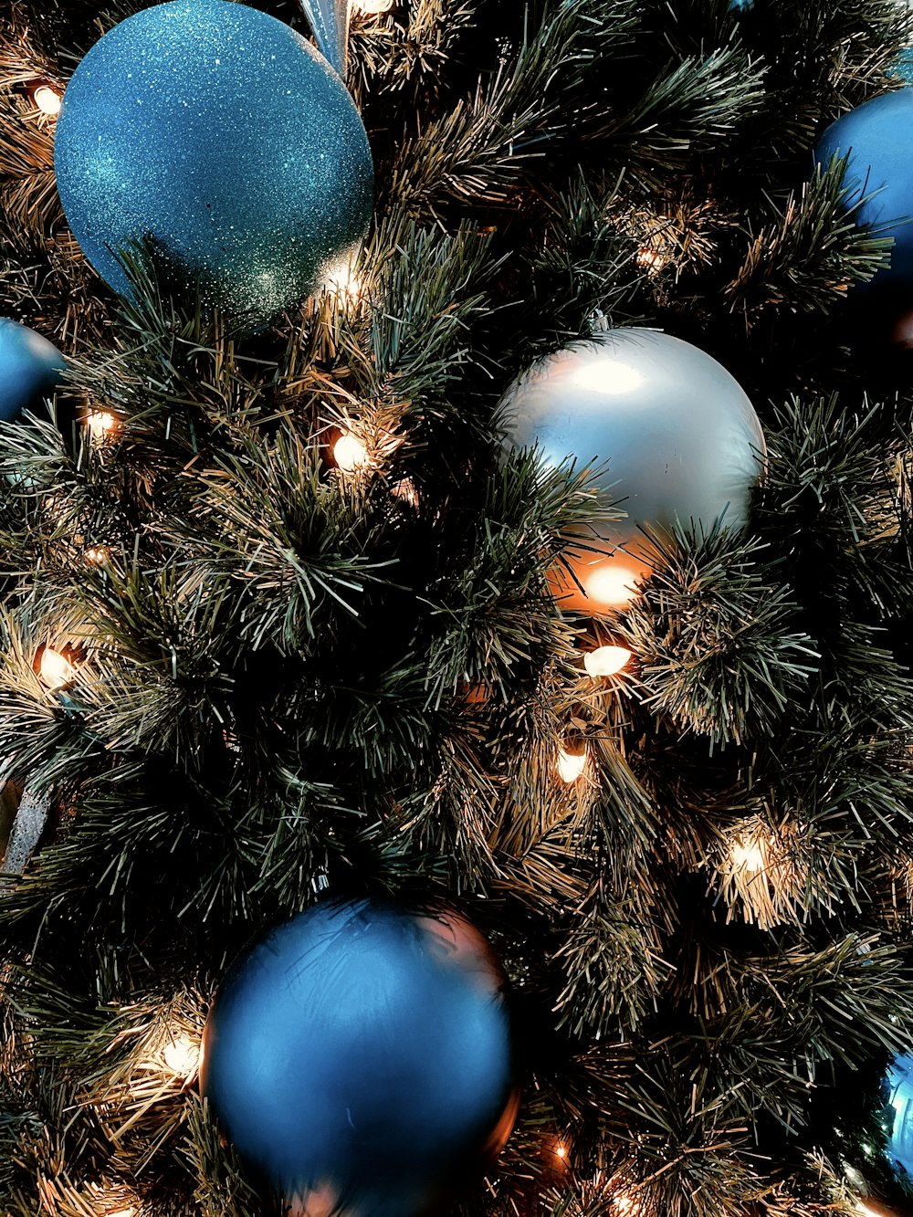 blue and white baubles on christmas tree