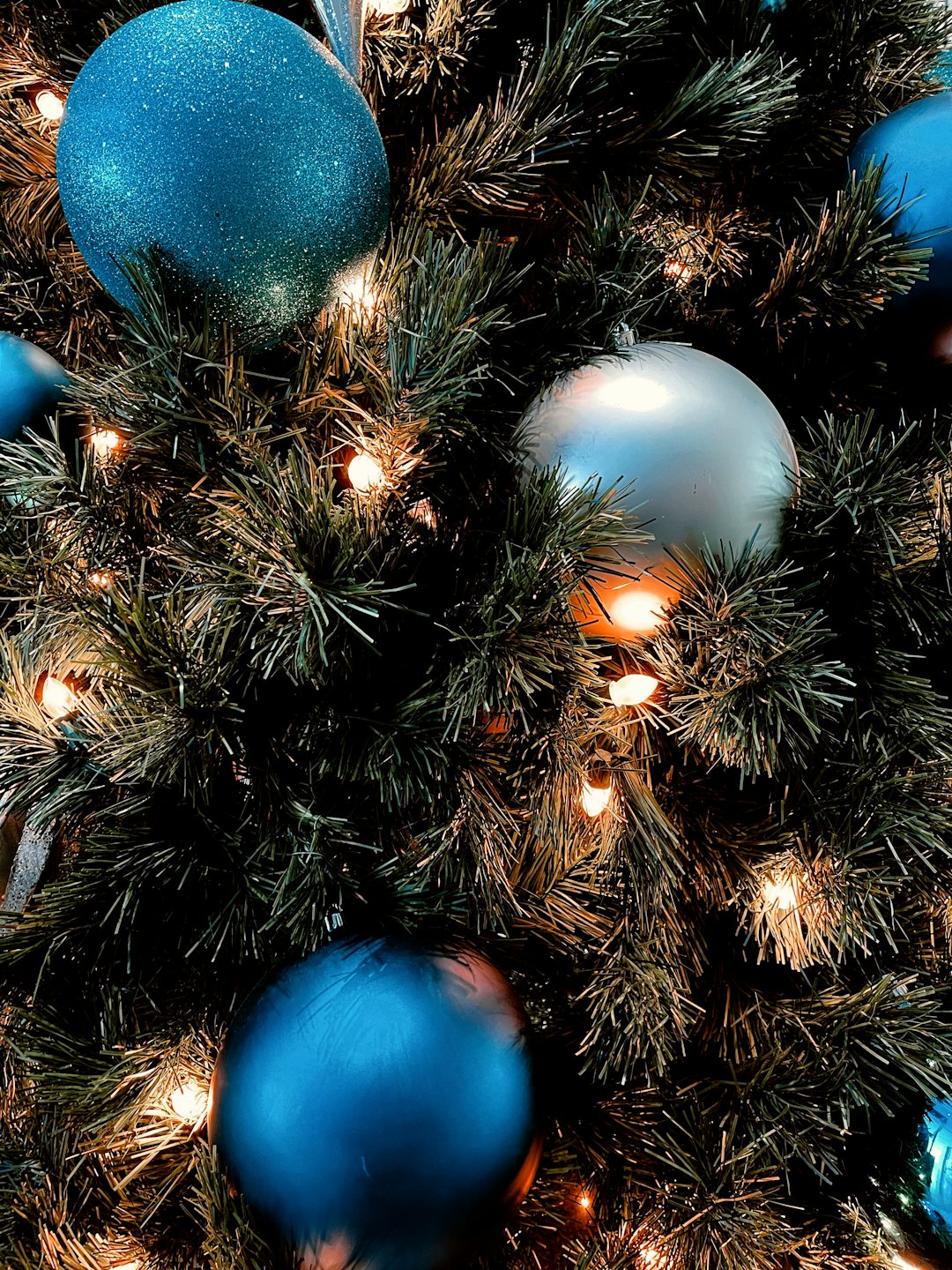 blue and white baubles on christmas tree
