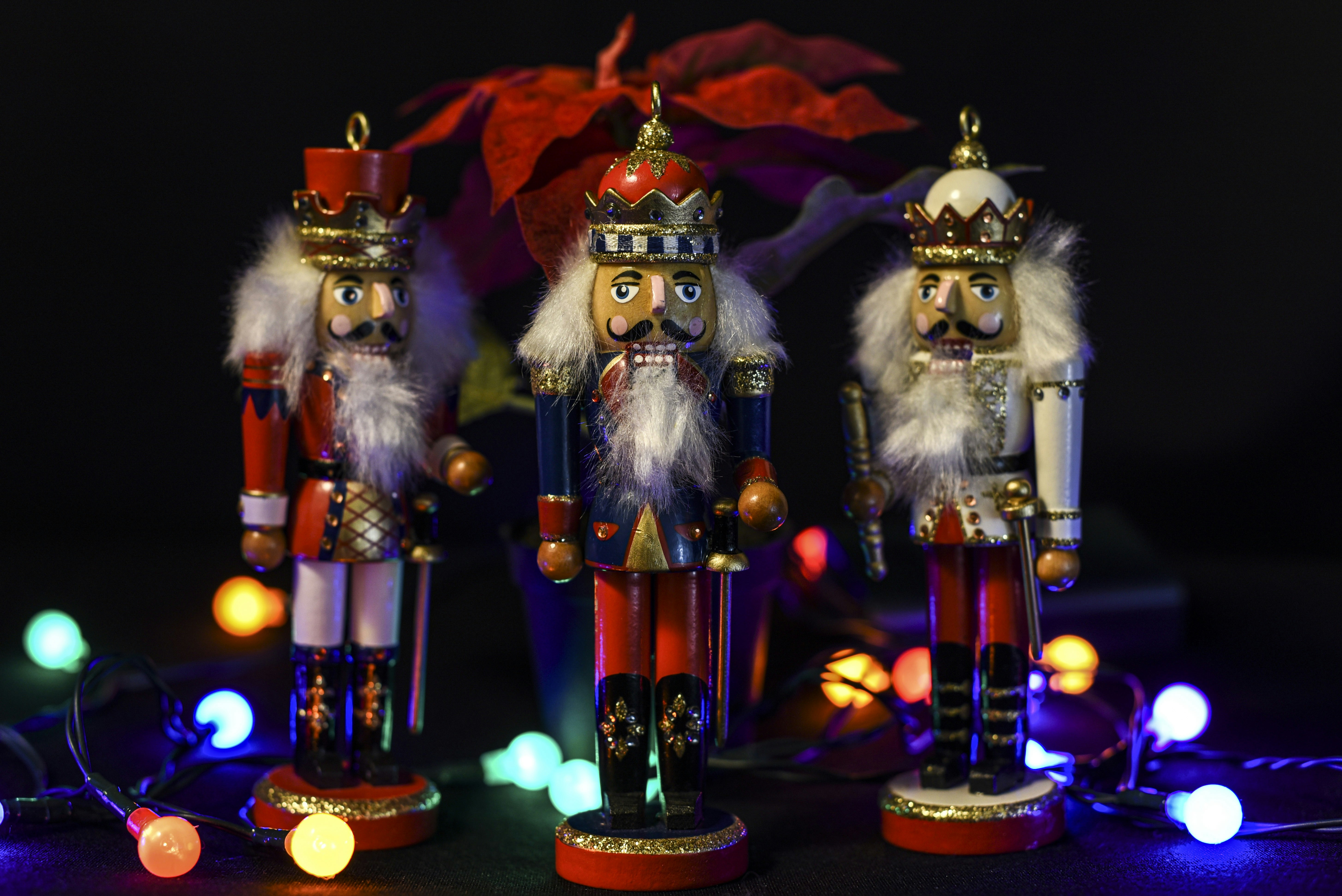 santa claus figurine with lights nutcracker teams background