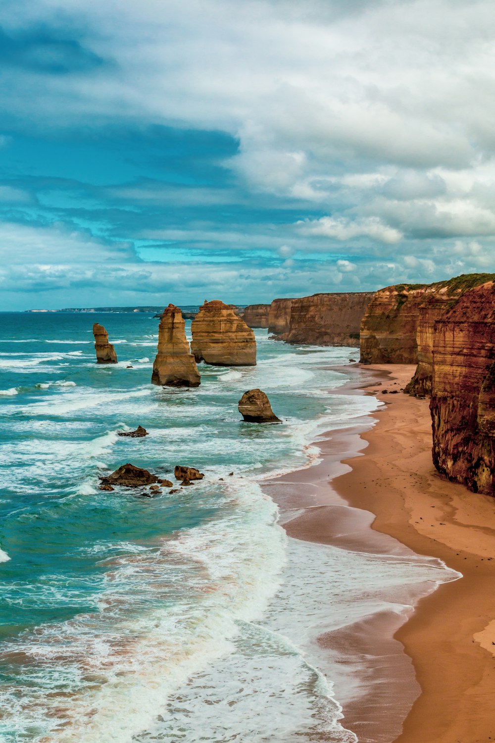 brown rock formation on sea shore during daytime