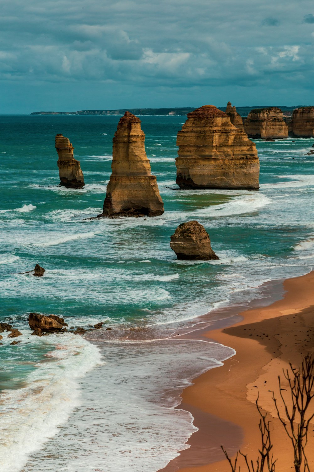 brown rock formation on sea shore during daytime