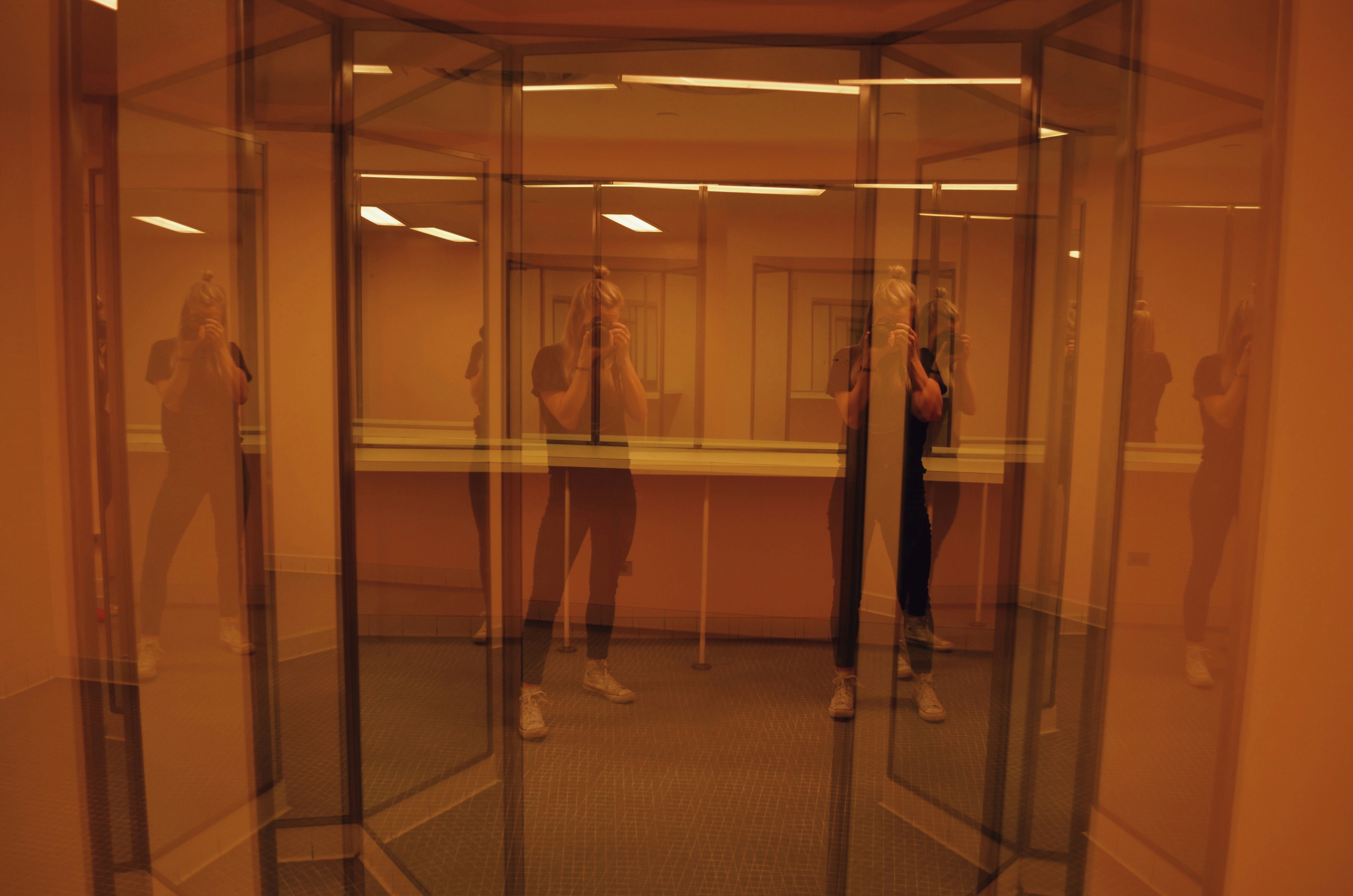 Woman in black dress at mirror