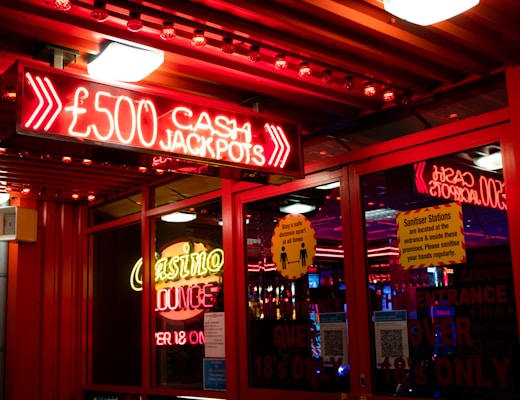 red and white coca cola neon signage