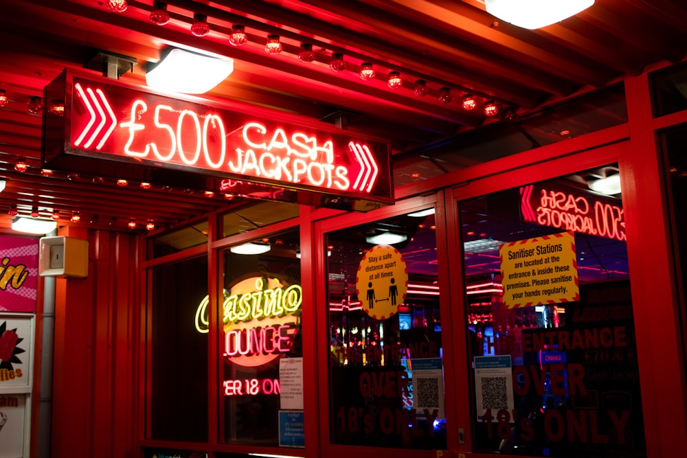 red and white coca cola neon signage