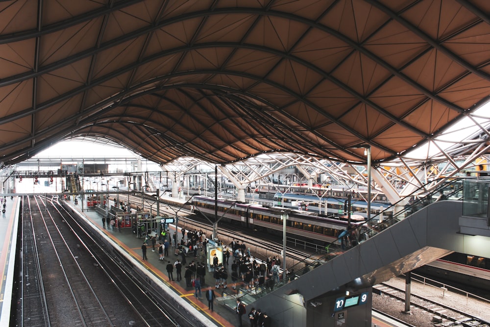 people walking on train station during daytime