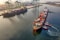 red and blue cargo ship on body of water during daytime