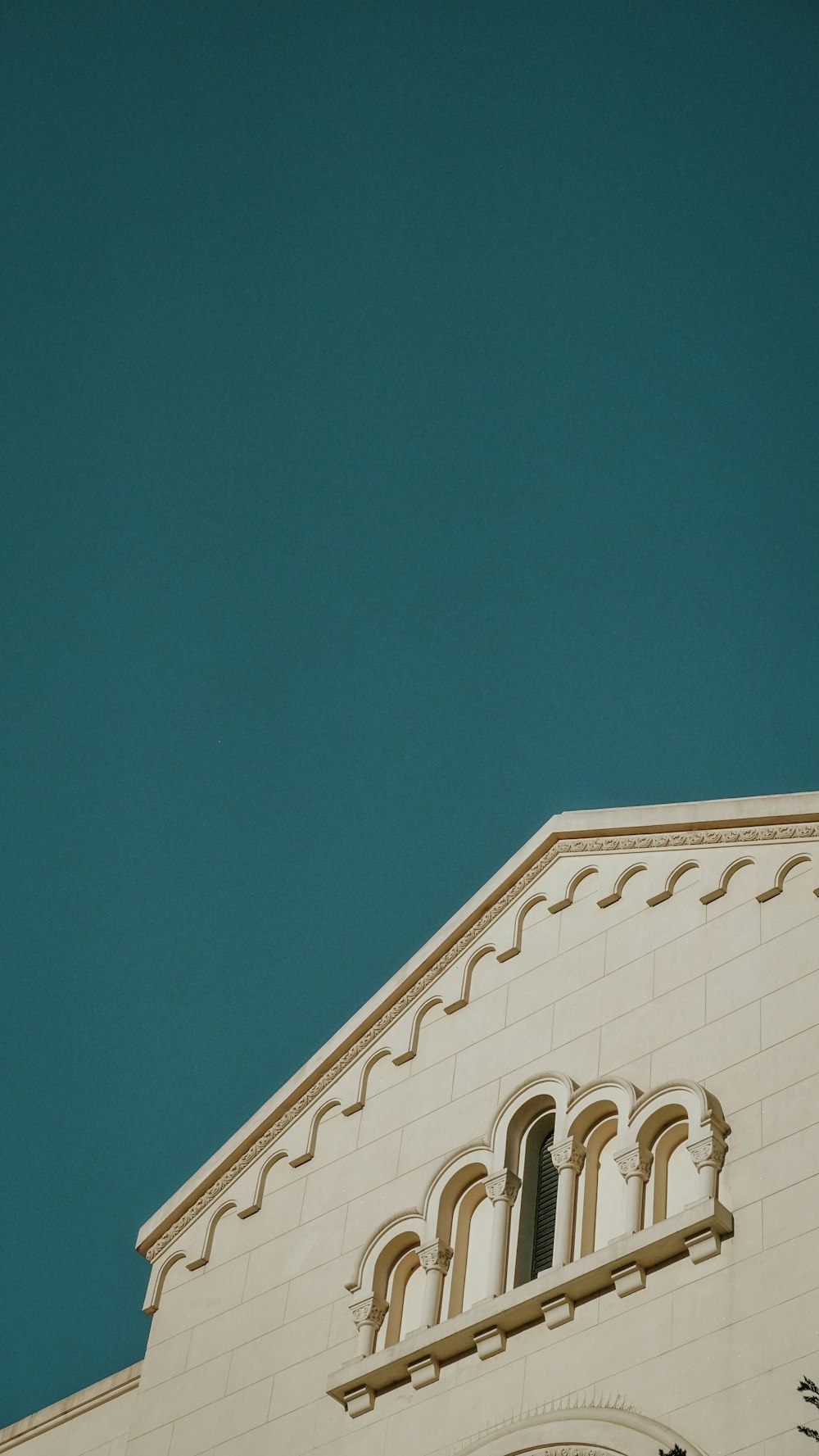 white concrete building under blue sky during daytime