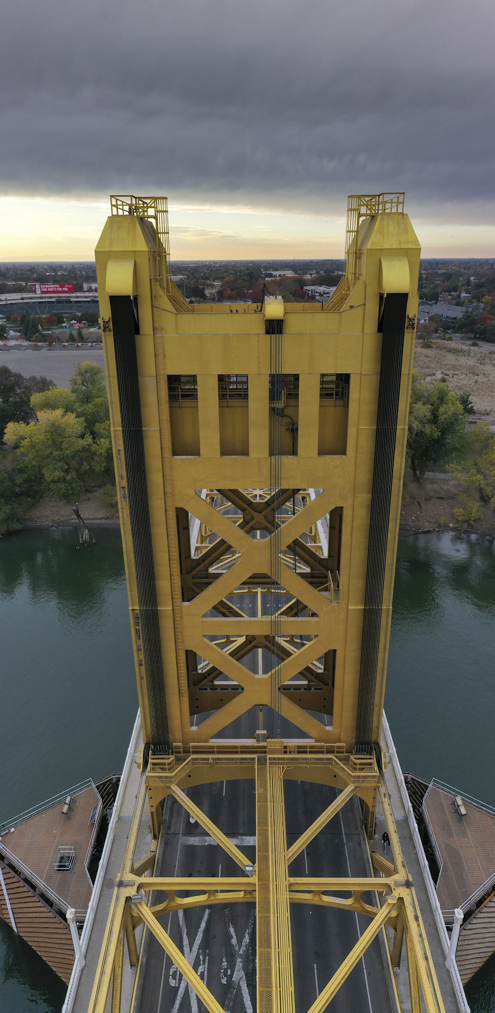 brown wooden bridge over river during daytime