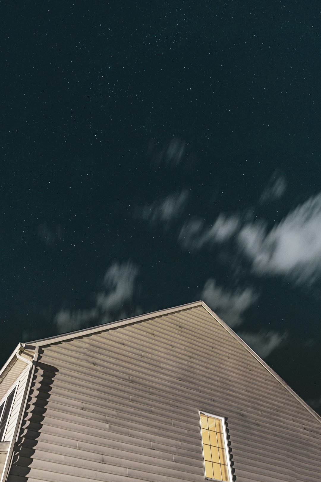 brown and white house under blue sky during night time