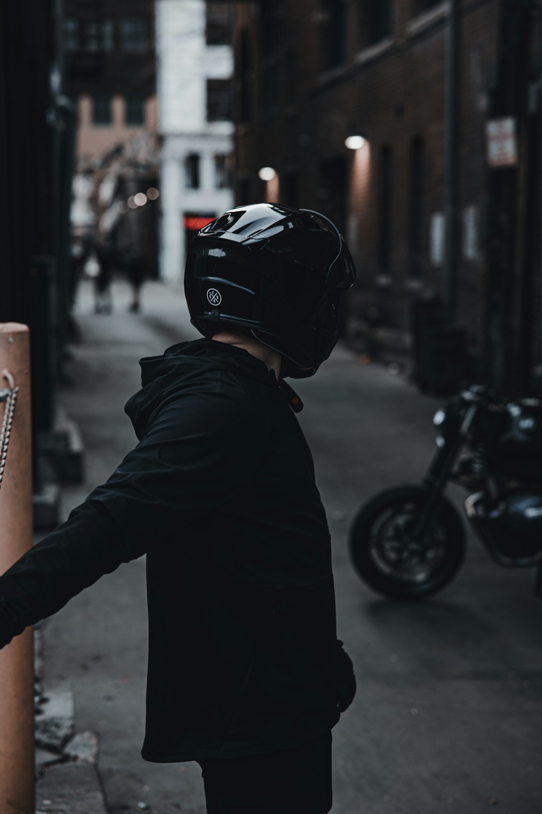 man in black jacket wearing black helmet