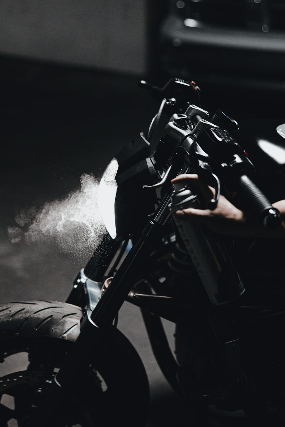 black motorcycle with white smoke