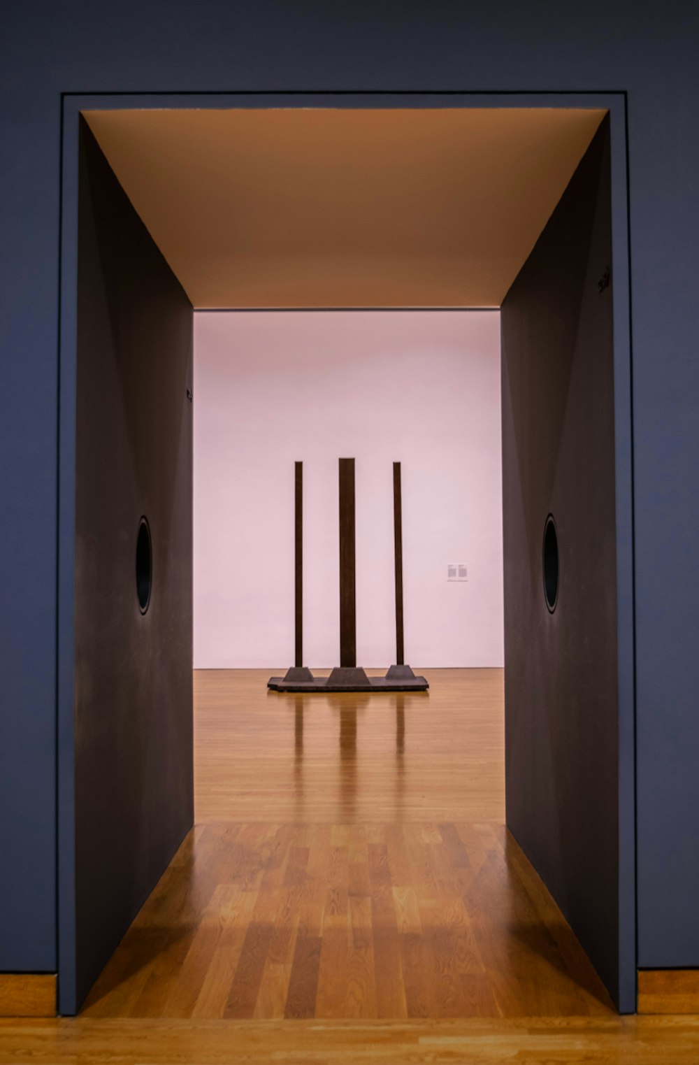 brown wooden parquet floor and white wall