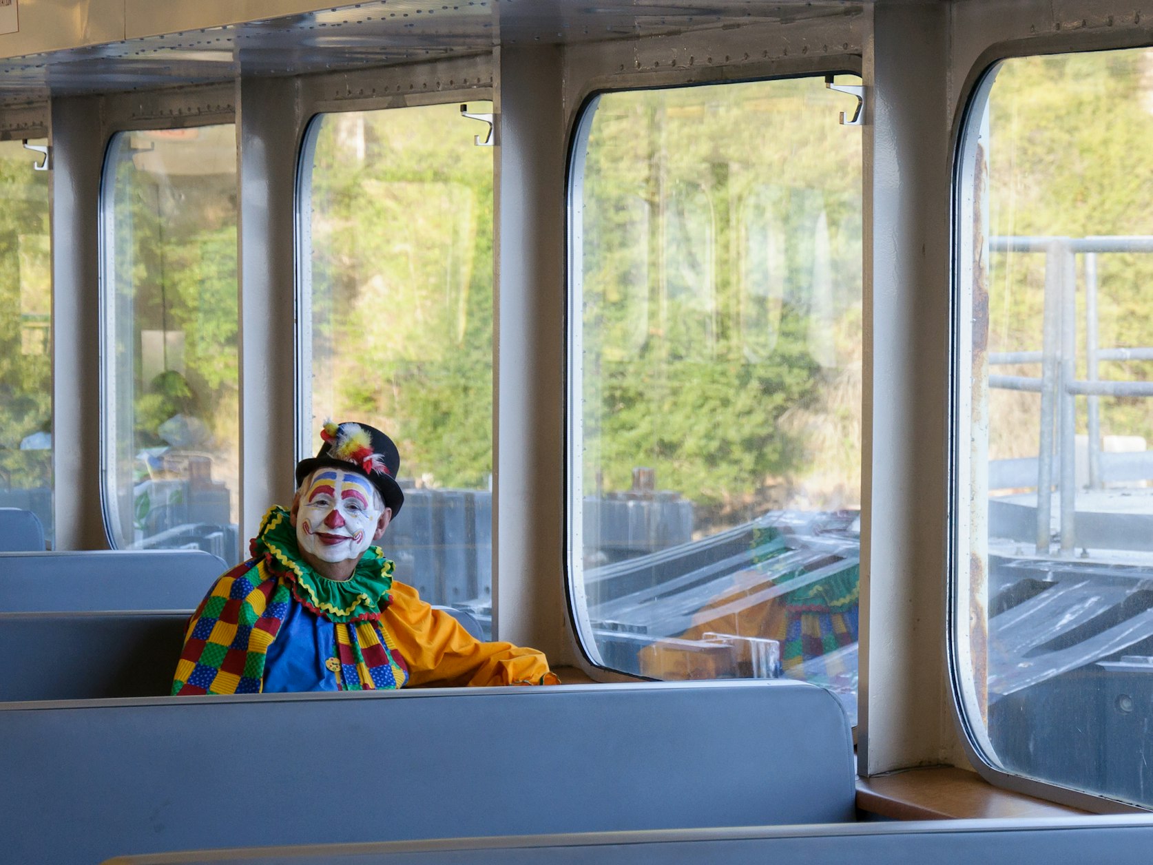 clown sitting on a bus