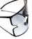 A pair of sleek, black sunglasses with tinted lenses is placed on a reflective surface. The sunglasses' modern design is emphasized by their minimalistic frame and large, rectangular lenses. The reflection creates a doubling effect, enhancing the visual impact.