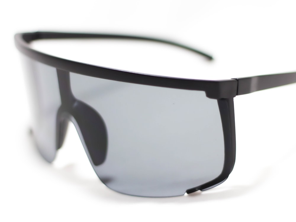 black framed sunglasses on white surface