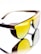 A pair of sunglasses with yellow tinted lenses and a dark brown frame. The design features perforated details on the frame corner near the temples. The reflective surface beneath them creates a mirrored effect, enhancing the visual impact.