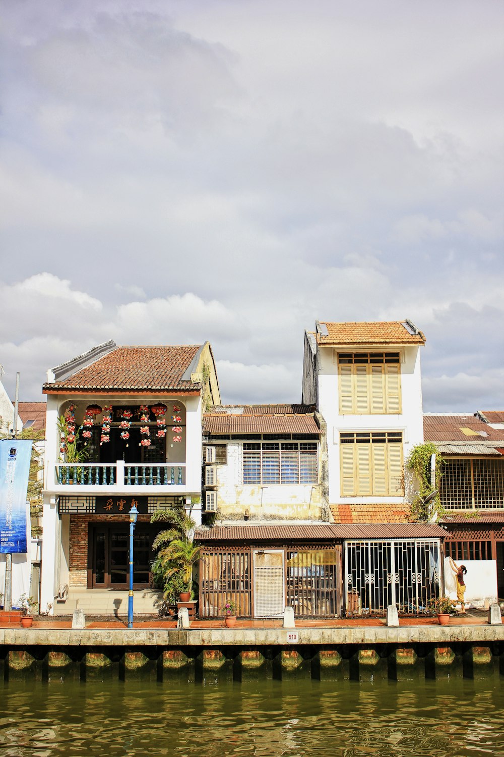 a group of buildings sitting next to a body of water