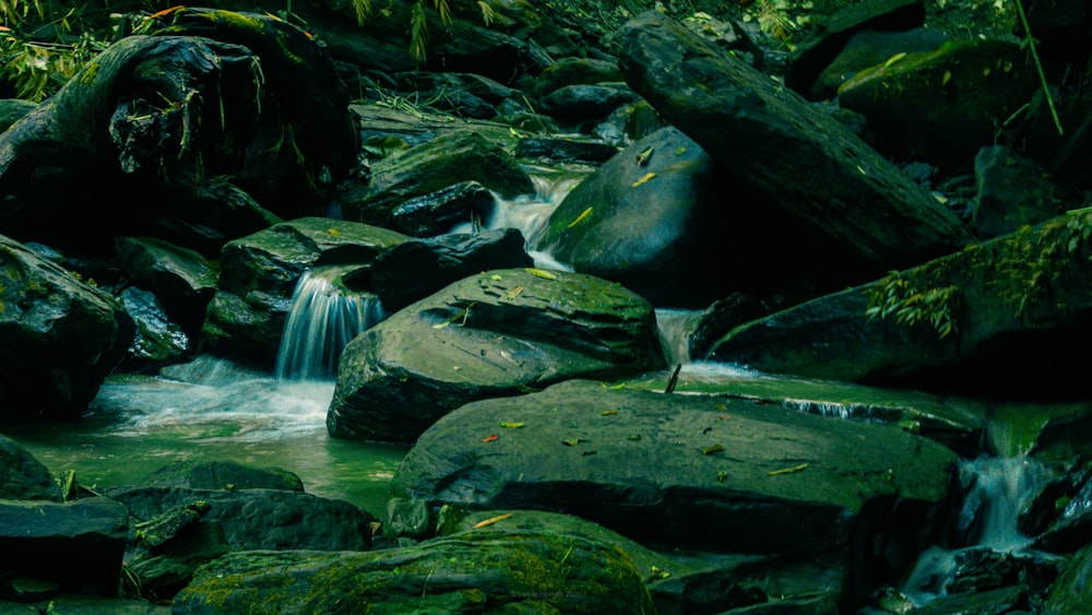 water falls on rocky shore