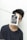 A person wearing a dark shirt appears to be partially covered by a monochrome photograph clipped to a line, obscuring part of their face. The photo has text saying 'It's okay not to be ok!' The background is plain white, and the line is strung horizontally across the image.