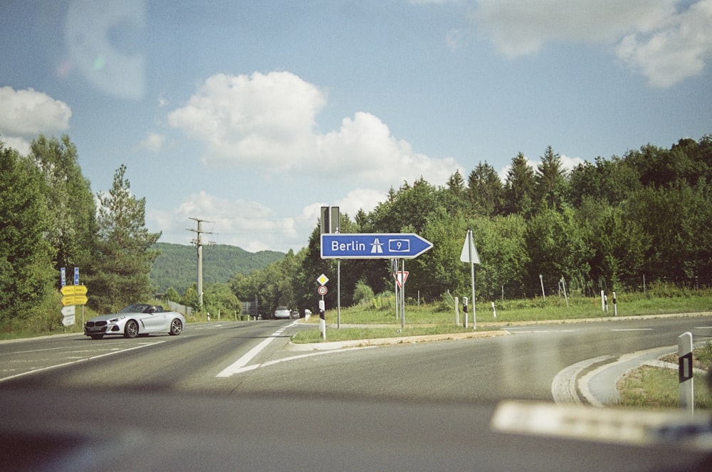 white car on road during daytime