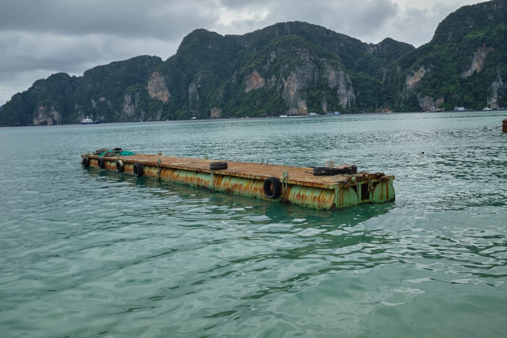 brown wooden dock on body of water during daytime