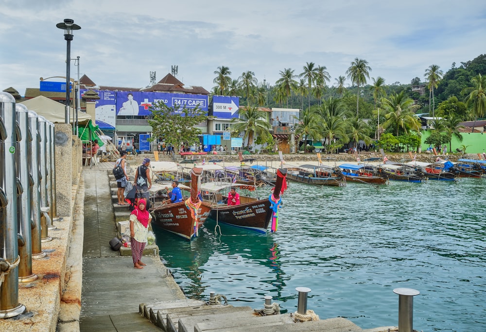 people on boat on dock during daytime