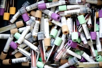 assorted color pen lot on white table