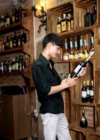 A person scanning a wine bottle with their phone, smiling as a heartfelt video plays.