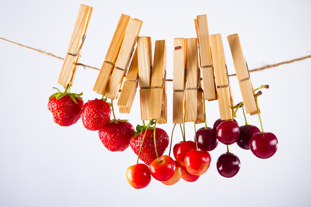 red cherries on white surface