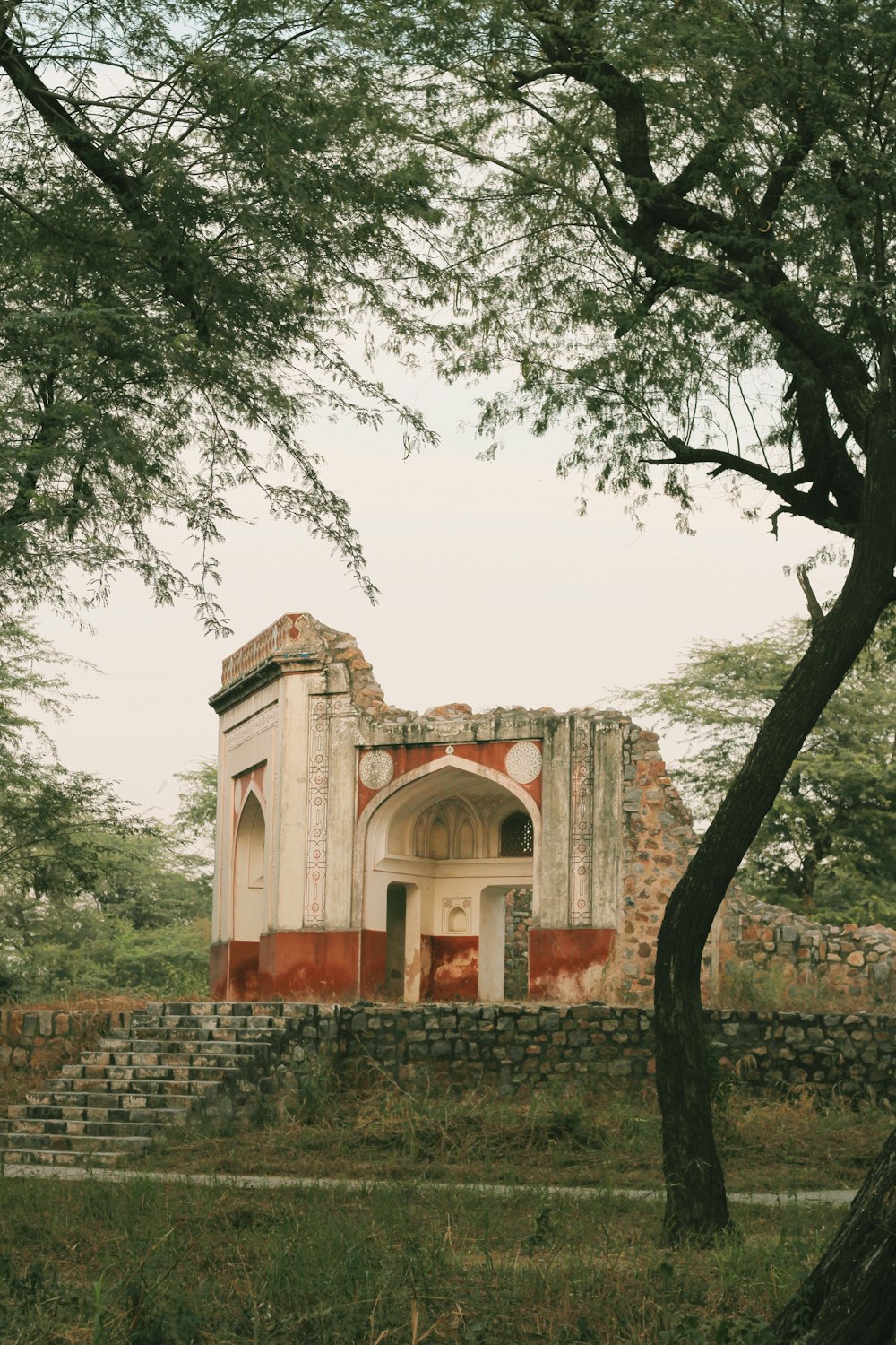 brown concrete building near green trees during daytime