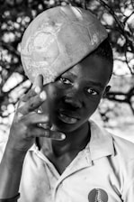 Close-up of a young player skillfully controlling a soccer ball during a futsal-inspired training session.
