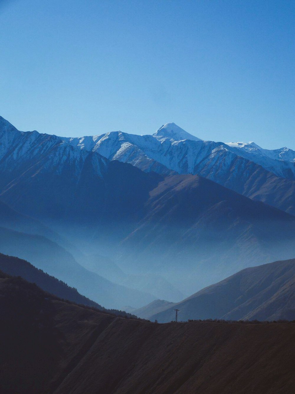 green and white mountains under blue sky during daytime