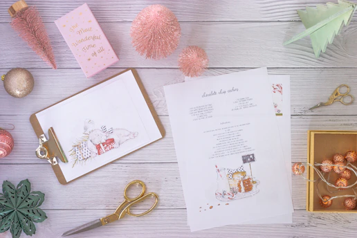 A colorful flat lay of printed event planning checklists with a pen and festive decorations