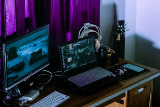 black laptop computer on brown wooden table