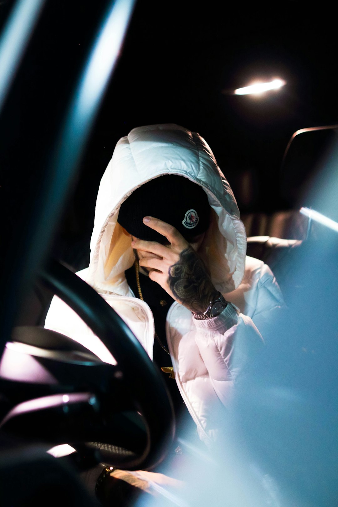 woman in white long sleeve shirt driving car