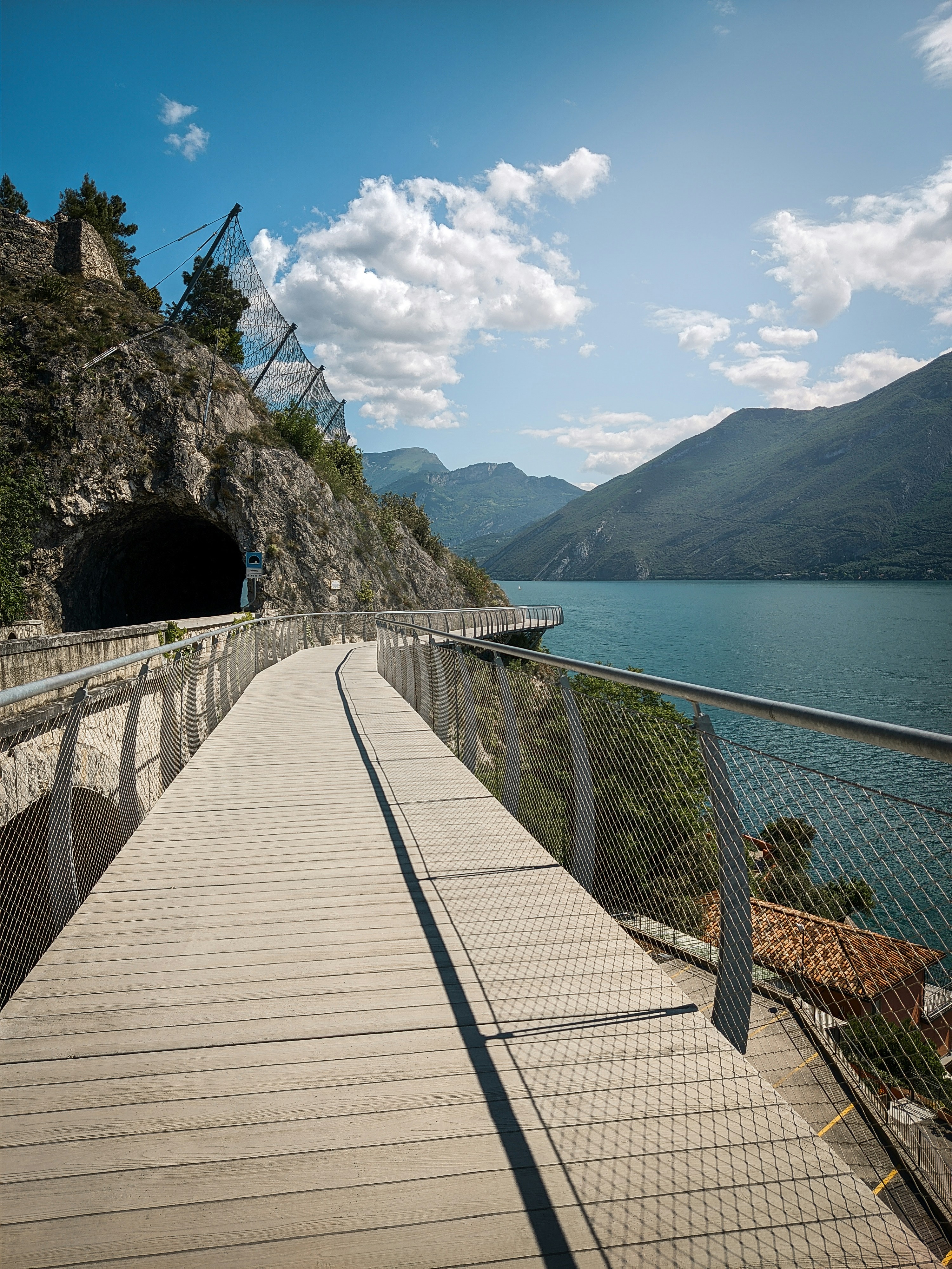 brown wooden bridge over the sea during daytime