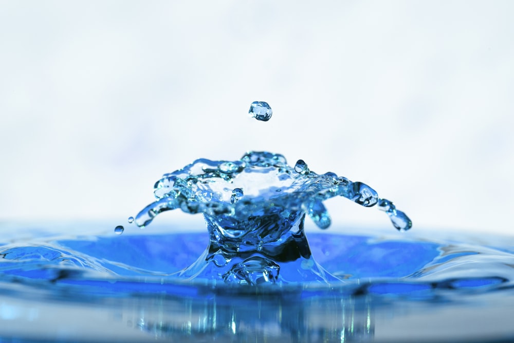 water drop on water in time lapse photography