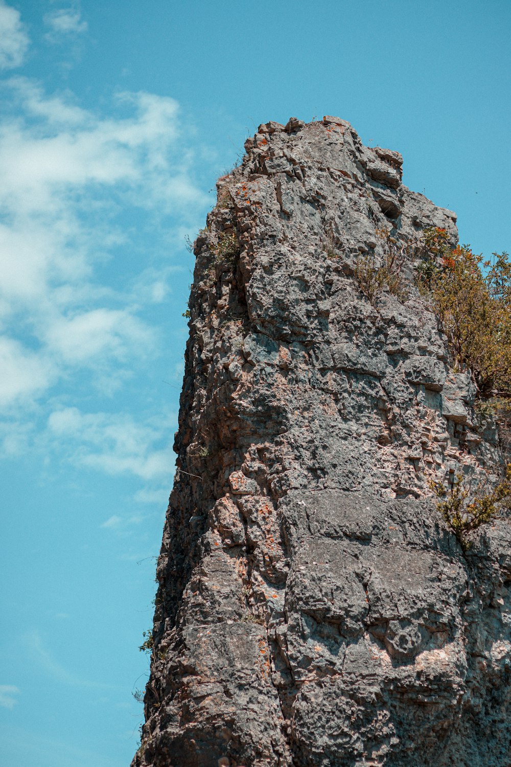 brown rock formation under blue sky during daytime