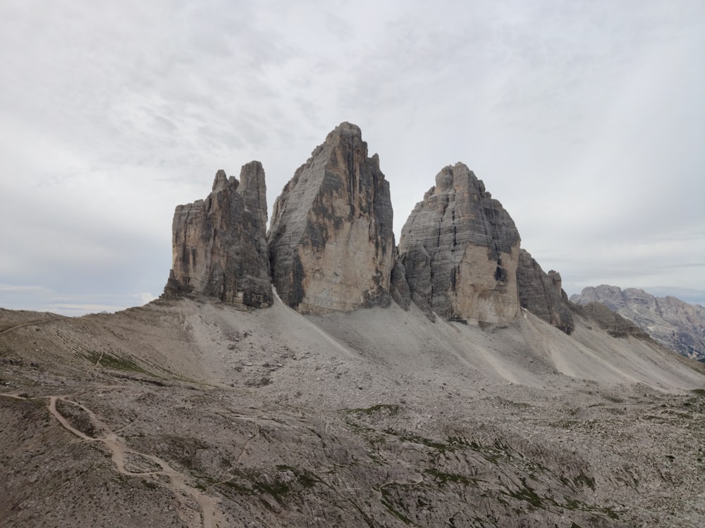 brown rocky mountain under white cloudy sky during daytime